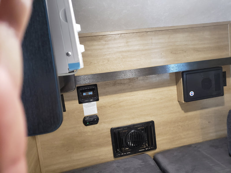 Explore this RV rental's interior: control panel (9:40 PM), safety detector, and WFCO power unit. — photo 8