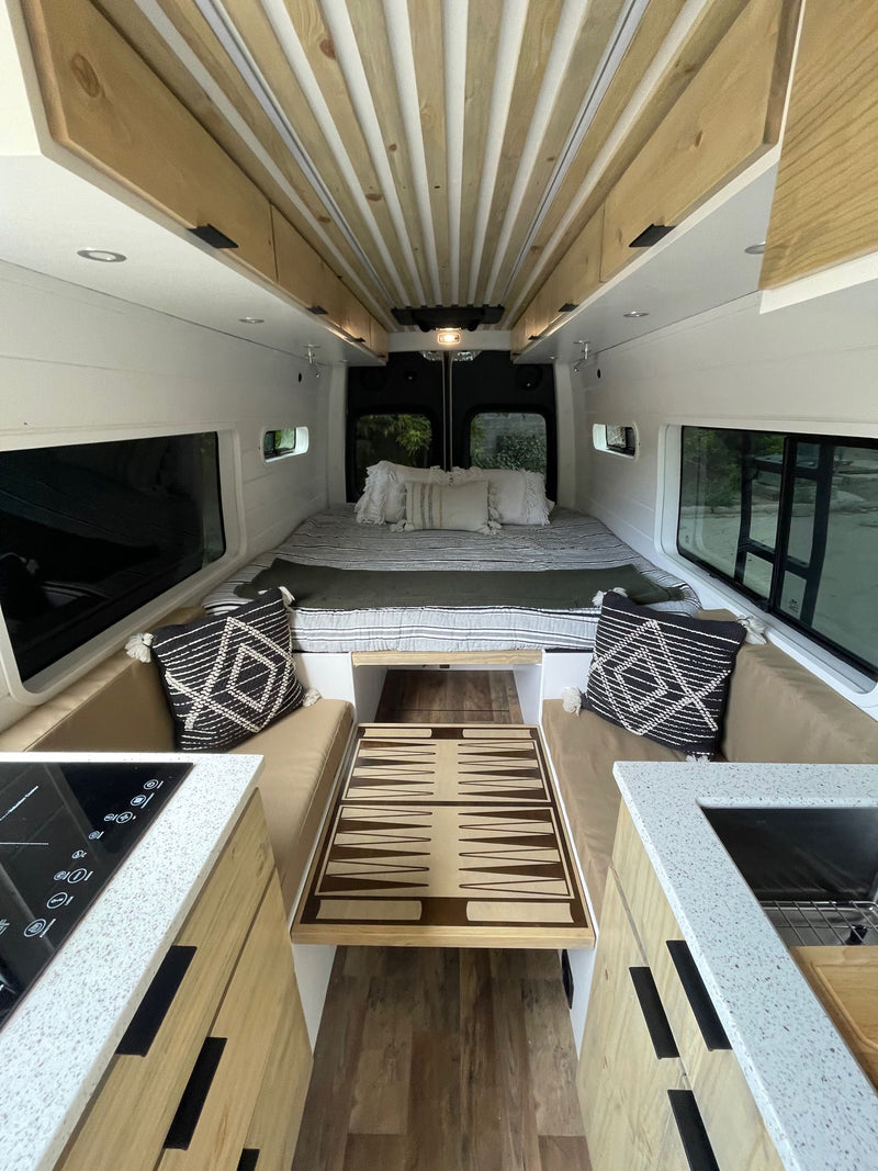  plus U-shaped lounge seating.|RV rental: inviting interior with a full bed — photo 7