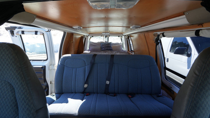 Spacious rv rental camper van interior with comfy bed, ready for adventure. Ideal for road trips. — photo 9