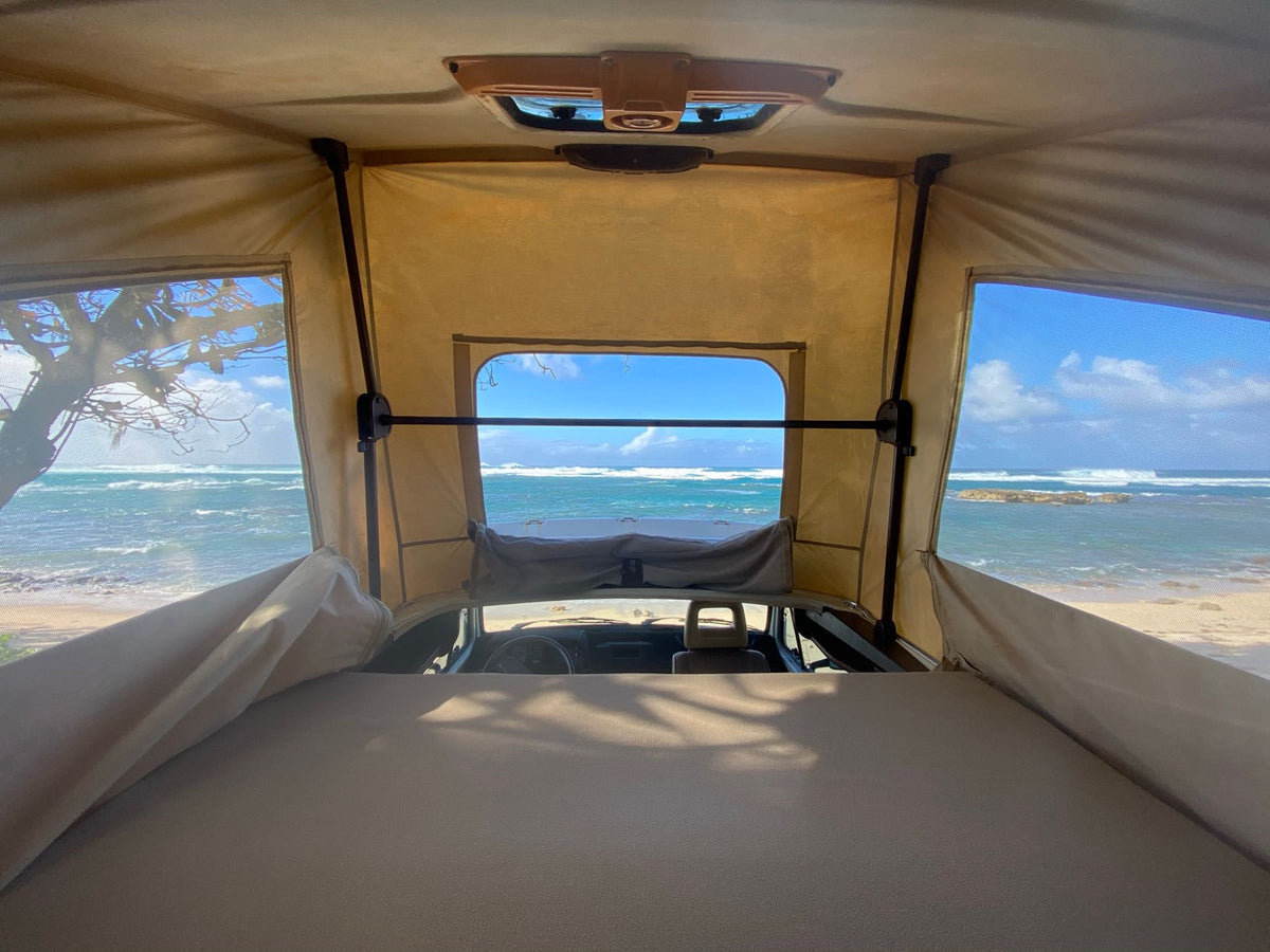  and windows revealing a scenic lake view.|Explore this clean RV rental interior! Features a compact kitchen
