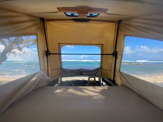  and windows revealing a scenic lake view.|Explore this clean RV rental interior! Features a compact kitchen