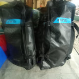 Two black NRS waterproof gear bags, ideal for storing essentials on your RV rental journey or any outdoor adventure.