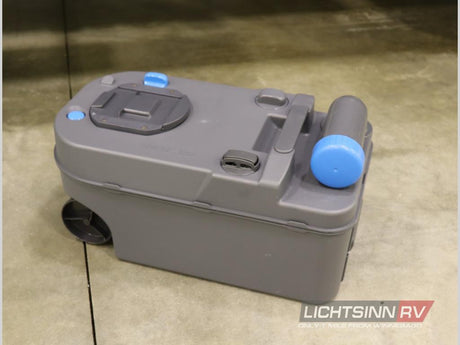 Grey portable RV waste tank with wheels and blue cap, essential for rv rental wastewater disposal.