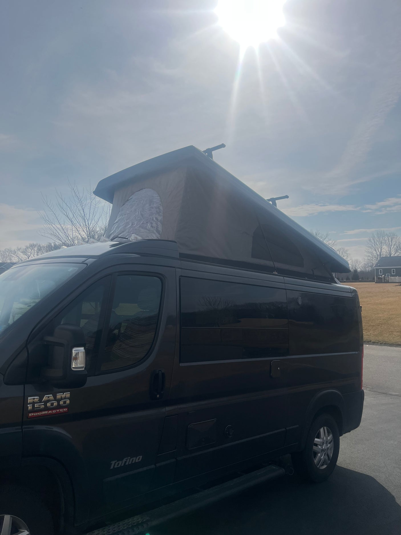 Dark Ram ProMaster camper van with extended pop-top, ideal for your next rv rental adventure.