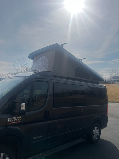 Dark Ram ProMaster camper van with extended pop-top, ideal for your next rv rental adventure.