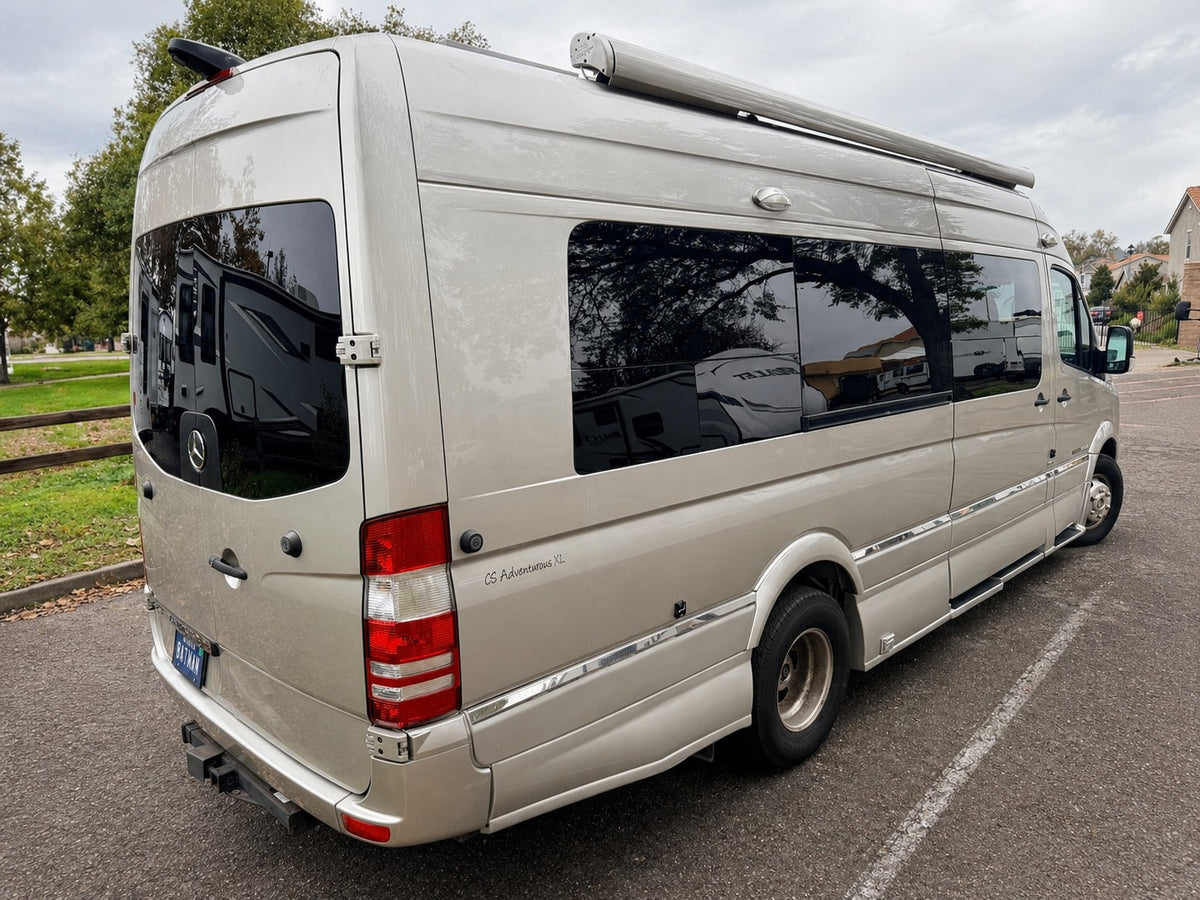 Champagne CS Adventurous XL Mercedes Sprinter camper van, perfect for rv rental. Rear-side view shows windows, awning, hitch. — photo 8