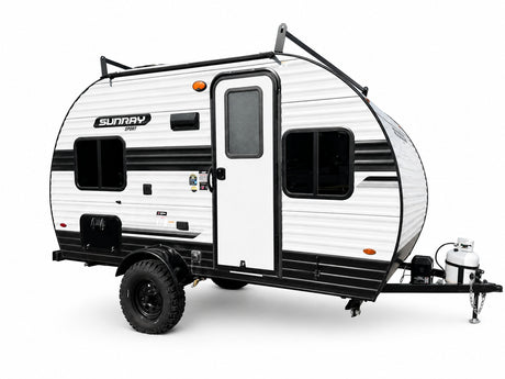 This Sunray Sport teardrop camper is an ideal RV rental for rugged outdoor adventures. White & black, with off-road tires.