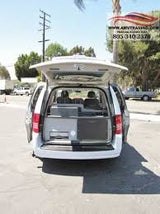 White minivan with tailgate and side doors open, showcasing interior for accessible RV rental.
