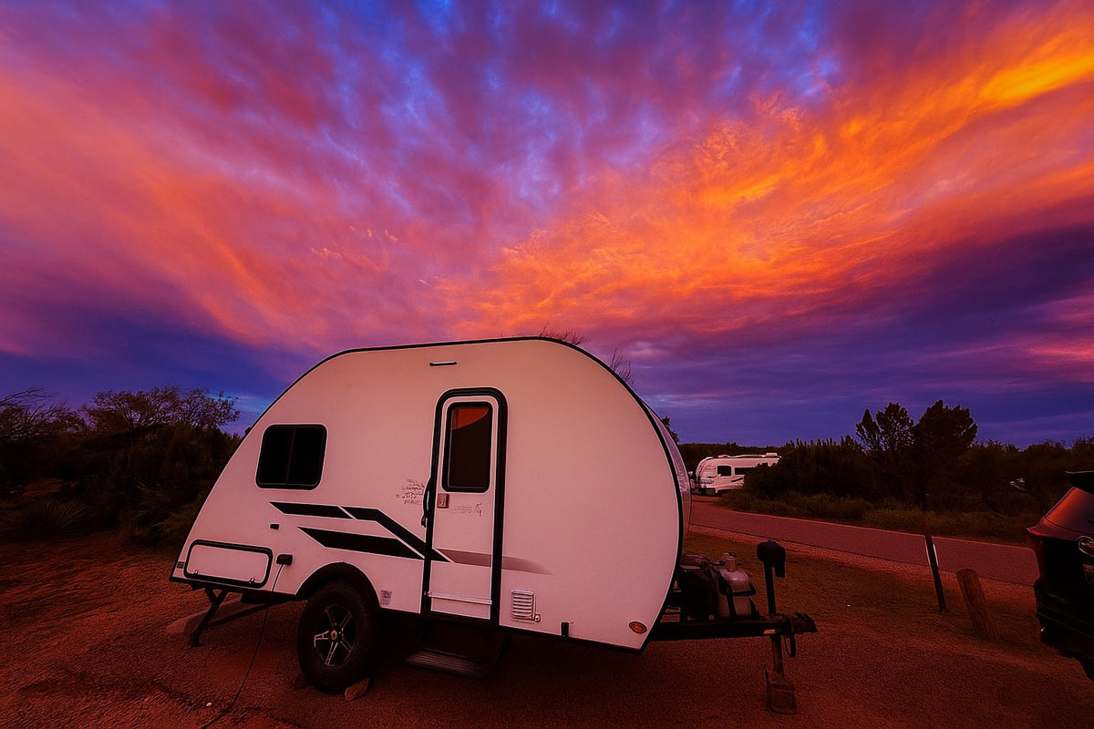 Camping with an RV rental under a stunning sunset. A white teardrop camper is set against a dramatic sky of orange, red, and purple clouds. — photo 8