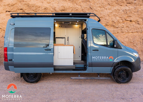  and modern faucet.|Step inside this RV rental camper van: kitchen with sink