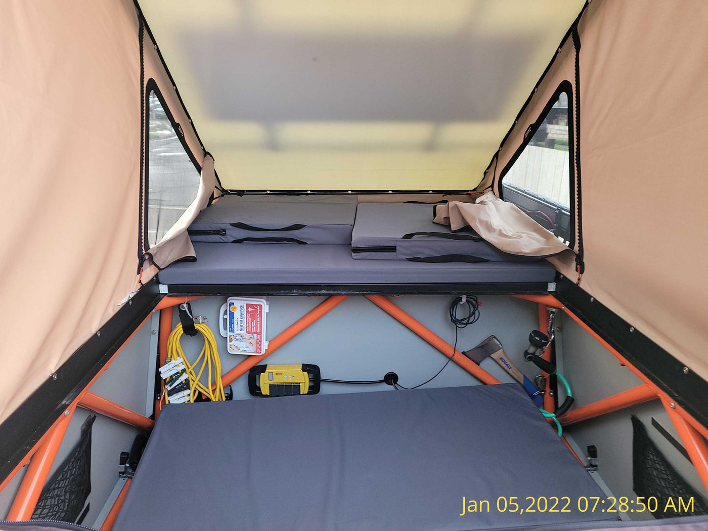  perfect for an RV rental camping adventure.|Interior view of a spacious rooftop tent — photo 6