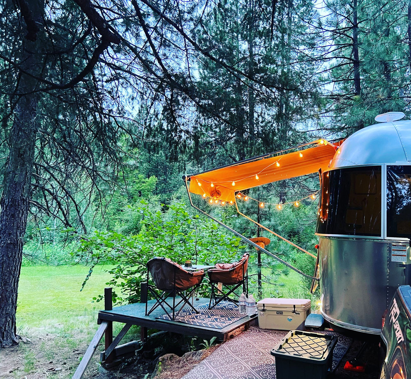  perfect for camping under the stars.|This inviting Airstream **rv rental** is set up for glamping in a peaceful forest clearing — photo 5