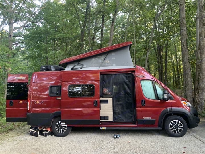  perfect for camping.|Red Winnebago Solis rv rental on a winding road — photo 12