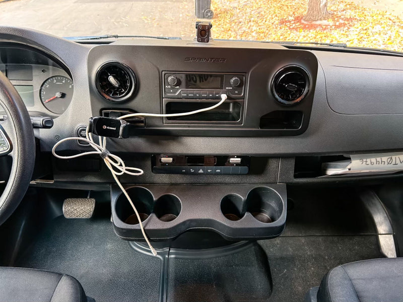  and seating area with car seats.|Rear view of a man relaxing inside an RV rental — photo 10