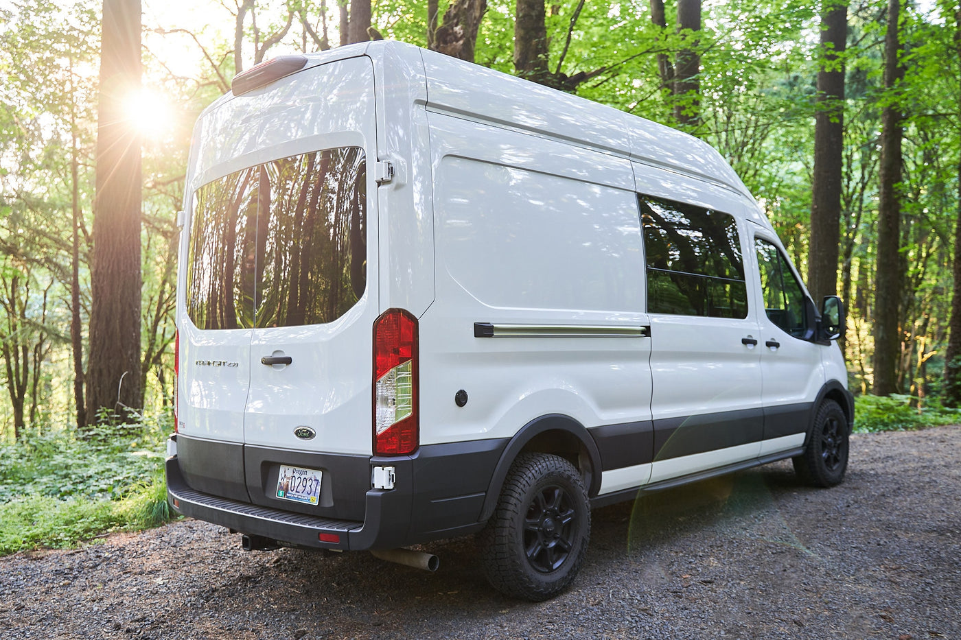  parked on gravel in a sunlit forest — photo 4