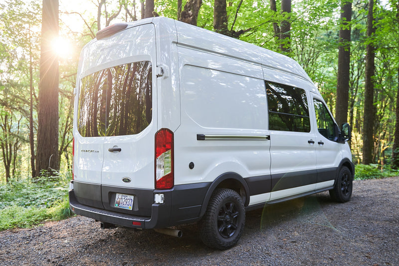  parked on gravel in a sunlit forest — photo 4
