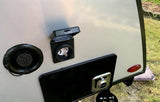 RV rental showing 30A shore power, water fill, and propane quick connect ports for camping hookups.