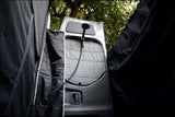 RV rental: Portable outdoor shower at vehicle rear, with black privacy enclosure. Ideal for camping.