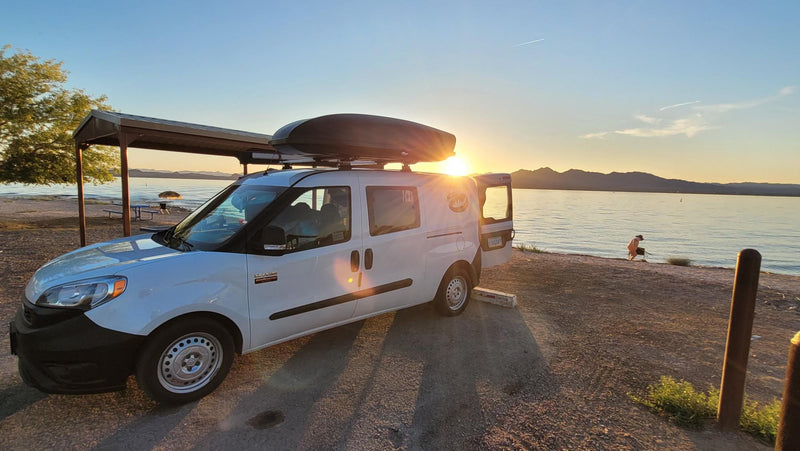 White Ram ProMaster City RV rental van at sunset by a lake — photo 1