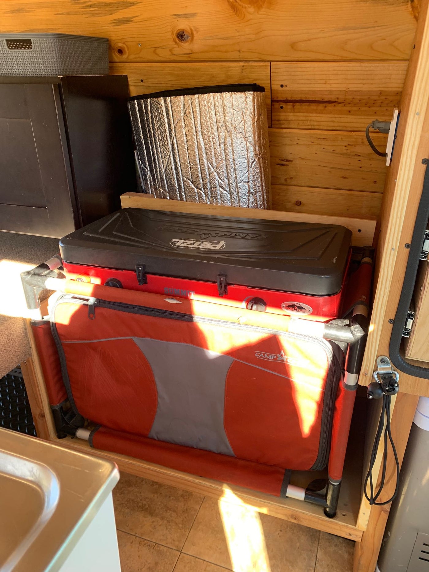  and the front cabin view.|Cozy custom van interior with wooden details & desert views — photo 8