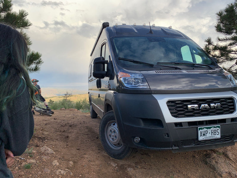  perfect for pet travel. Colorado plates.|Off-road RV rental adventure! A dark Ram camper van & mountain bikers on a scenic Colorado dirt trail.|Explore this RV rental's modern kitchen: wood counter — photo 2
