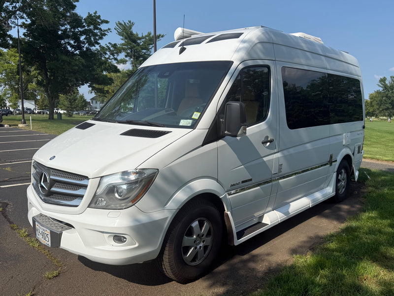 featuring an awning and rooftop Dometic AC unit.|A white Mercedes-Benz Sprinter RV rental — photo 2
