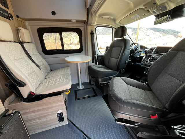  featuring unique quilted sections and scenic rear views for your trip.|RV rental's compact kitchen setup: sink — photo 7