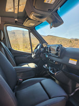 Spacious RV rental interior from passenger side. Shows driver's