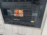 Black Contoure microwave, convection, and air fryer in an RV rental kitchen. Versatile cooking for your travels.