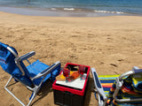 Beach day bliss: Two chairs and wine by the sea, perfect after an RV rental adventure.