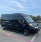 Luxury black RAM Promaster van, suitable for rv rental. A spacious travel vehicle parked under a blue sky.