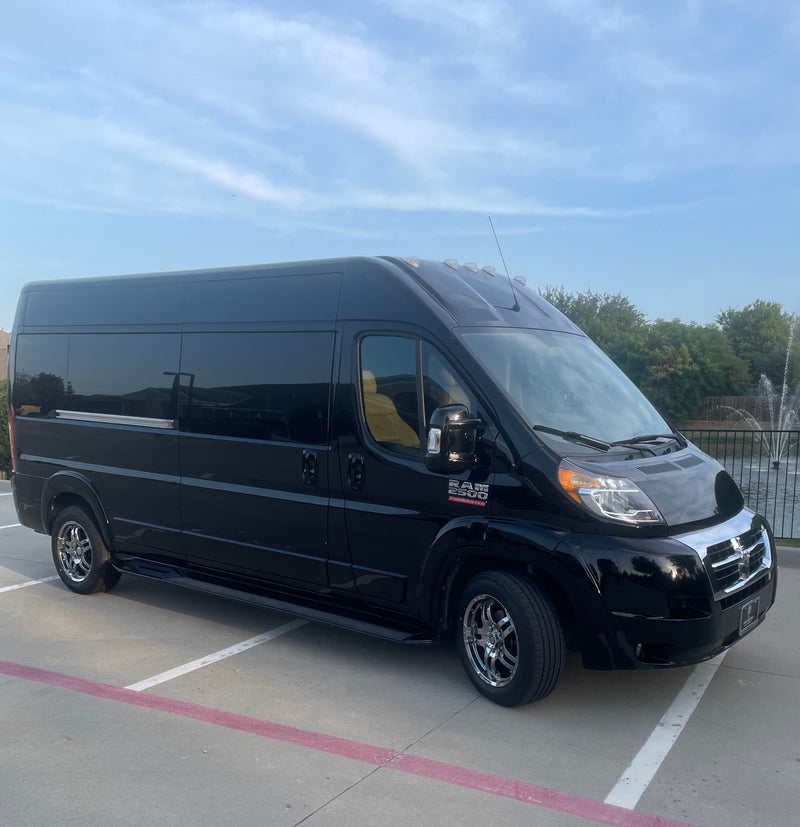 Luxury black RAM Promaster van, suitable for rv rental. A spacious travel vehicle parked under a blue sky. — photo 1