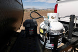RV rental setup: Propane tank and battery box on a travel trailer tongue, ready for adventures with mountain views.