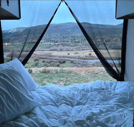 Wake up to stunning mountain & river views in this cozy RV rental! Perfect for nature lovers and travel.