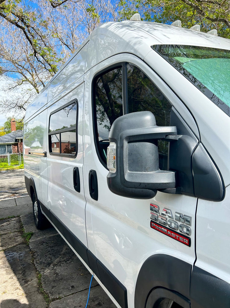  and functional amenities for mobile living.|A compact RV rental kitchen featuring a Camp Chef oven/stove — photo 17