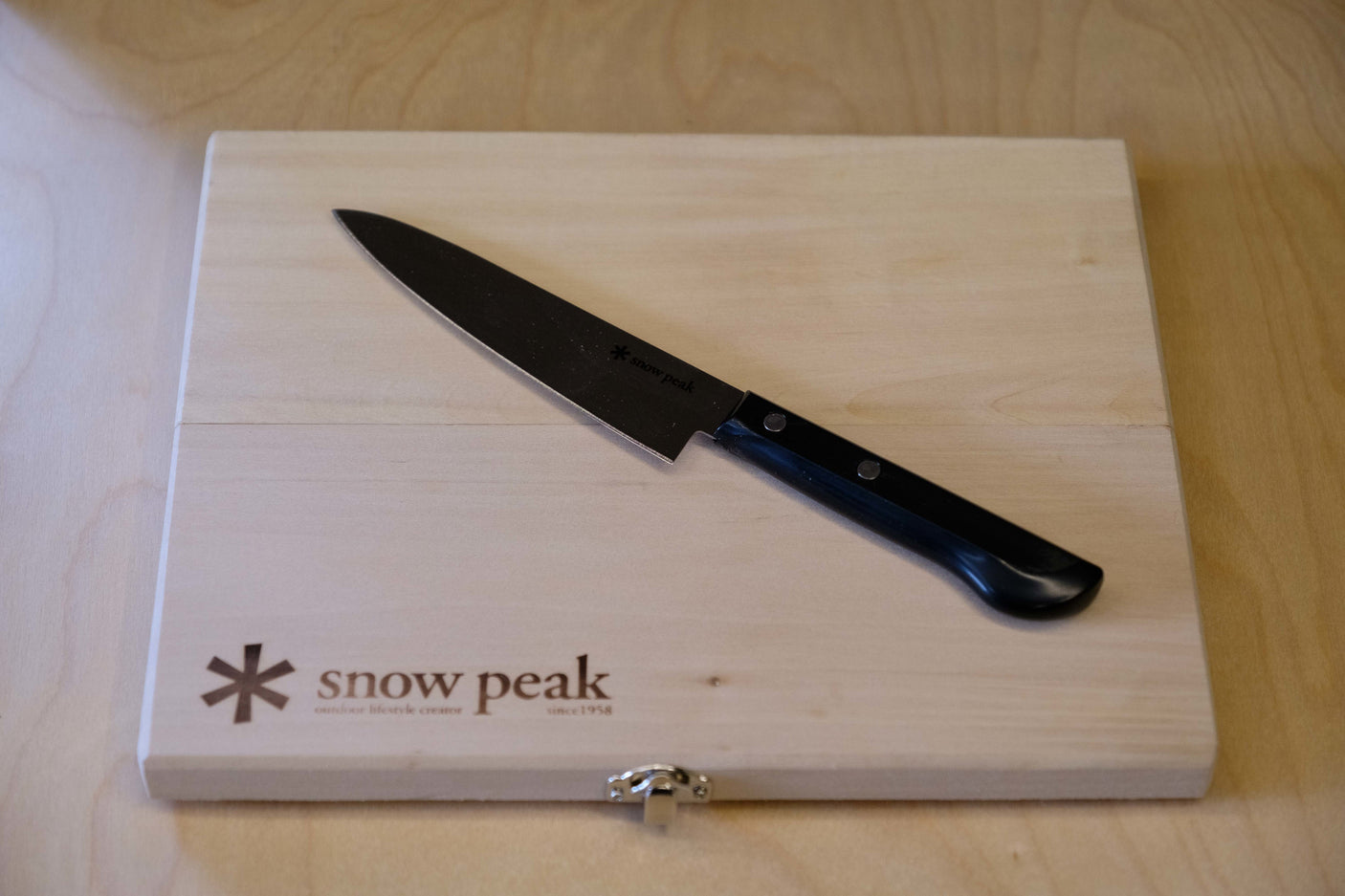 Snow Peak knife and board, ideal camping kitchen gear for your RV rental adventures.