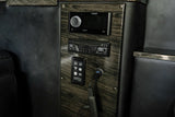 RV rental: Close-up of a luxurious interior control panel featuring Fusion stereo, Blu-ray player, and custom media controls.