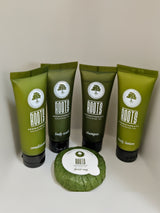 RV rental toiletries: ROOTS Eucalyptus Tea shampoo, conditioner, body wash, lotion, and facial soap for a fresh stay.
