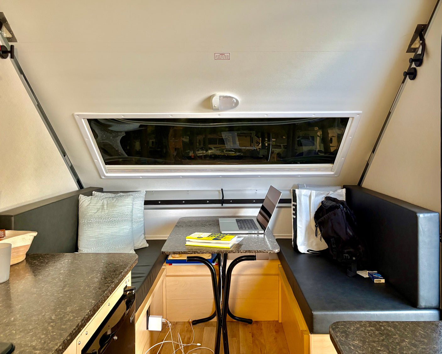 Experience comfort in this RV rental's clever interior. A laptop-ready dining area and scenic window views define this compact space.