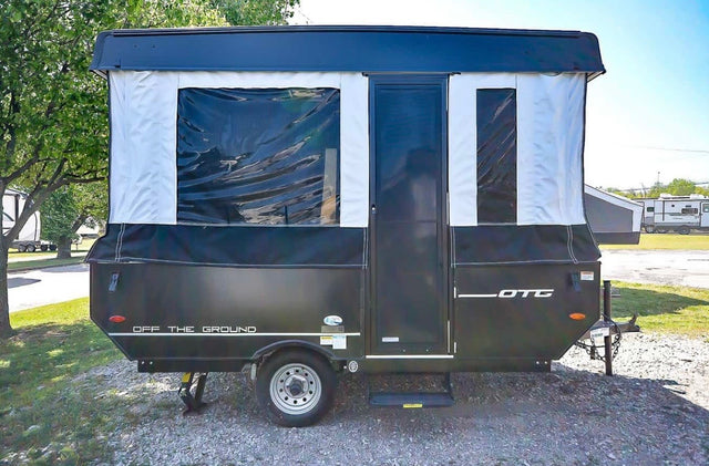 Rent this "Off The Ground" pop-up RV travel trailer. Features black & white canvas walls & clear windows.