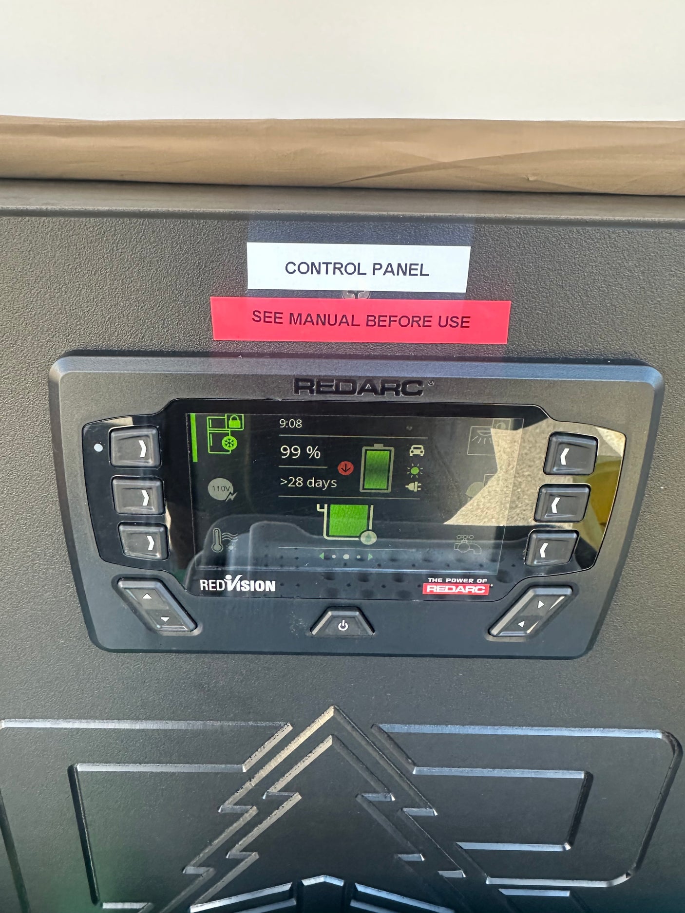 This RV rental's Redarc control panel shows battery power at 99%, with >28 days remaining for off-grid adventures.
