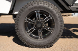 Goodyear Wrangler off-road tire and black alloy wheel on an RV rental trailer.