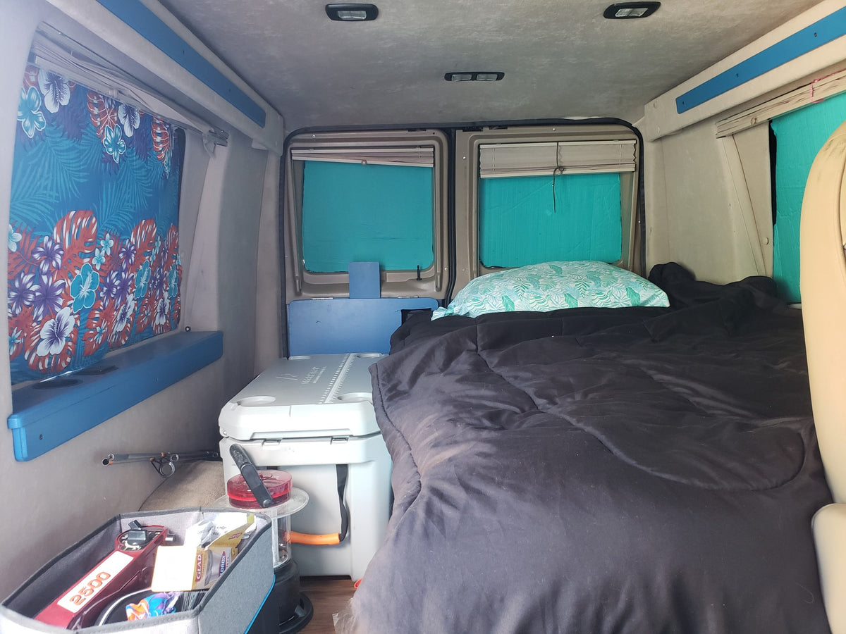  shown parked. Could be used as an RV rental.|RV rental van interior: driver's seat (torn) — photo 9