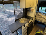 Step inside this RV rental, featuring a compact kitchen with sink/cooktop, extendable counter, and a comfy bed. Enjoy nature!