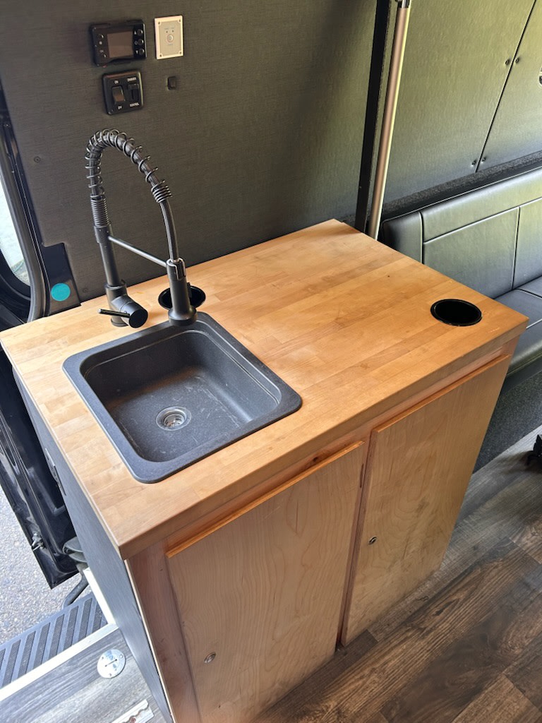  and the structured sleeping platform above.|This RV rental interior features practical overhead storage — photo 10