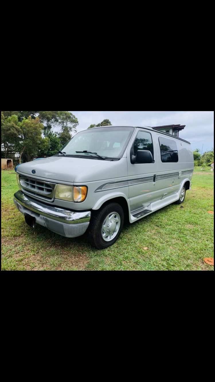 Silver Ford conversion van for RV rental, ideal for travel and camping adventures. — photo 13