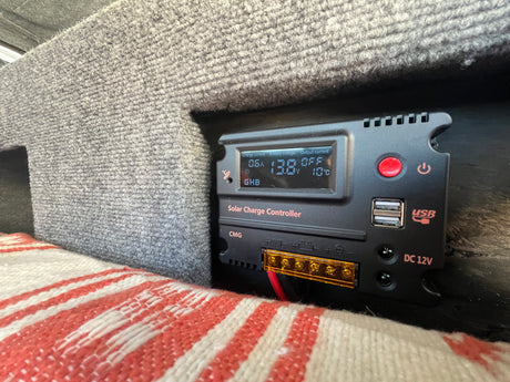 Monitoring off-grid power in an **rv rental**: A **solar charge controller** displays **battery voltage** (13.8V) and 10°C.
