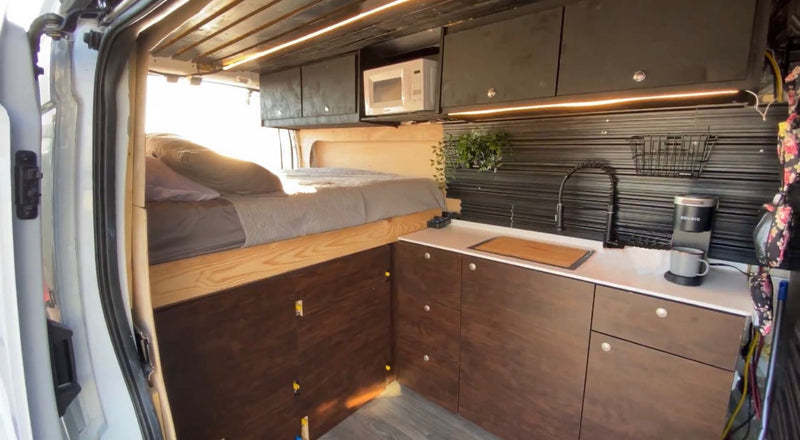  perfect for RV rental. Parked outside with door open.|Compact rv rental interior with bed — photo 2
