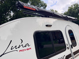 This white Luna Rover camper, equipped with ALLTOP overland gear, is a prime **RV rental** for outdoor adventures.