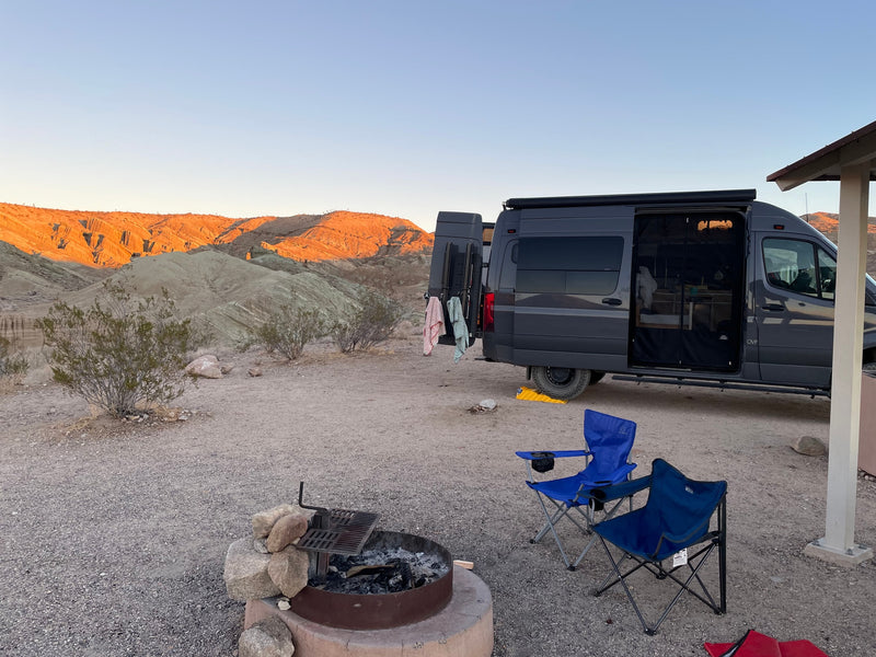  revealing cozy interior & gear storage.|Screenshot of a glowing RV rental review for Manzanita camper van from GoCamp — photo 14